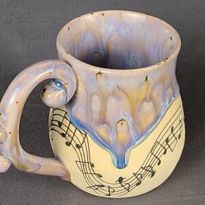 Purple mug with musical illustration