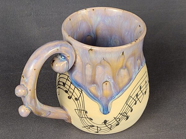 Purple mug with musical illustration