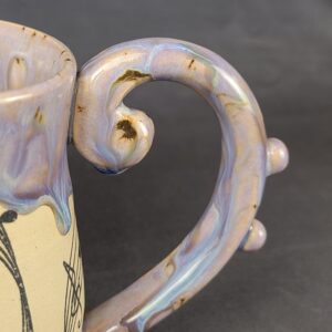 Purple mug with artistic musical style handle