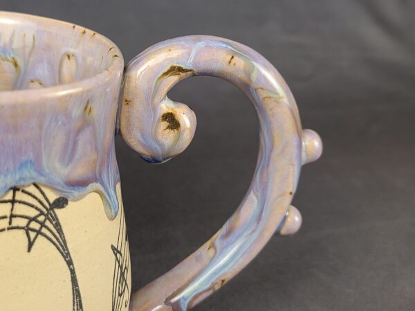 Purple mug with artistic musical style handle