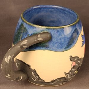 Blue mug with illustration of cat and birds