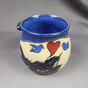 Blue mug with cat illustration