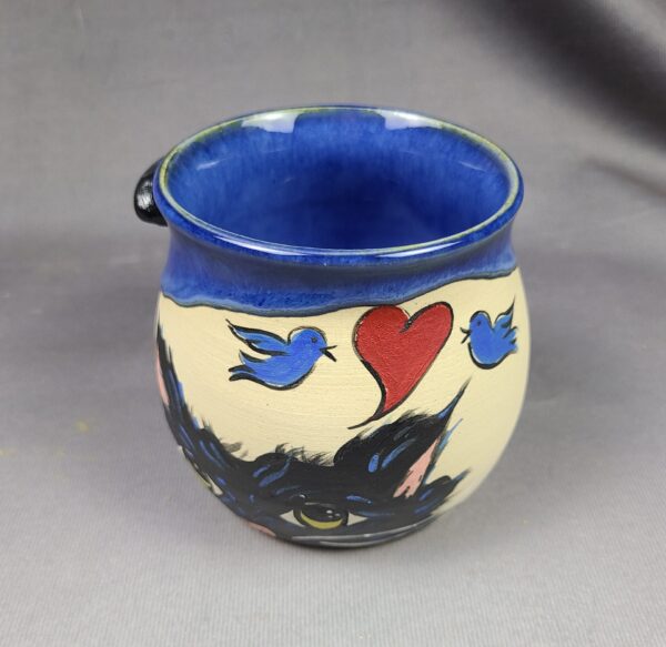 Blue mug with cat illustration